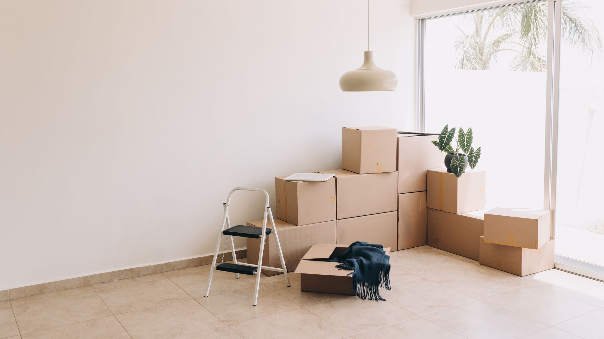 A room filled with boxes and a chair